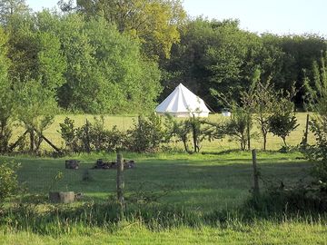 Our deluxe bell tent, from across the meadows. (added by manager 15 jul 2013)
