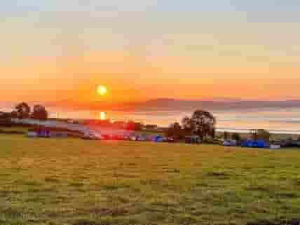 Visitor image of the excellent sunrises with coastal views at the top of the field.