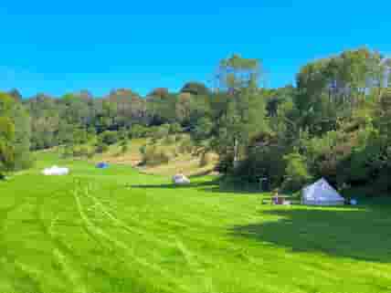 Bell tents pitched on site (guests' own tents)