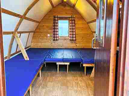 Coming soon, two Wigwam Glamping pods. Inside with mattress/bed made up.