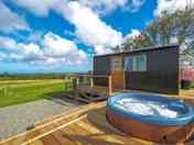 Decking surround with hot tub and gorgeous views. (added by manager 06 Oct 2022)