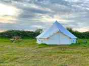 Bell Tent exterior with picnic table (added by manager 16 Mar 2023)