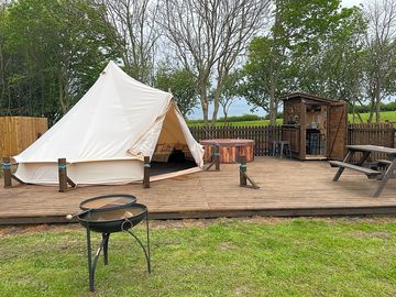 Bell tent with hot tub, picnic bench, firepit and campers' kitchen