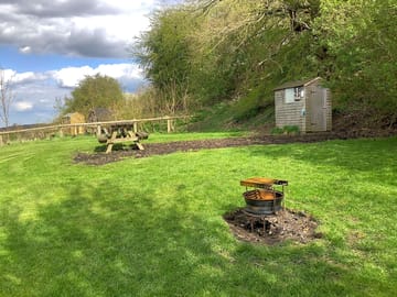 Toilet shed, campfire pit and picnic table on each pitch