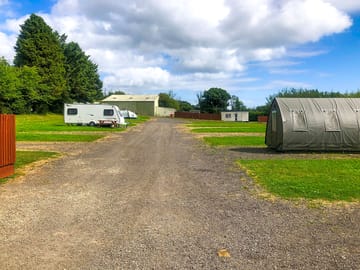 Electric hardstanding and grass touring pitch