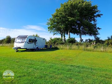 Fully-serviced grass touring pitch