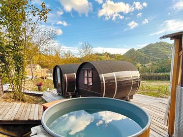 Sleep in a cosy pod with forested hill views