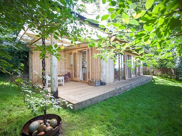 Tree-shaded cabin with decking