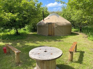 The yurt sleeps up to five people, with a kingsize bed, plus comfy bed mats for children