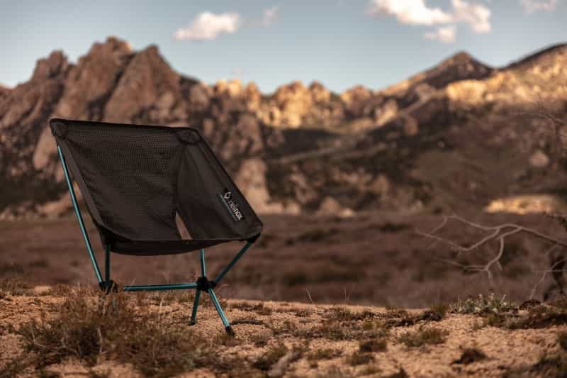 A scoop camping chair in the mountains (Patrick Hendry / Unsplash)