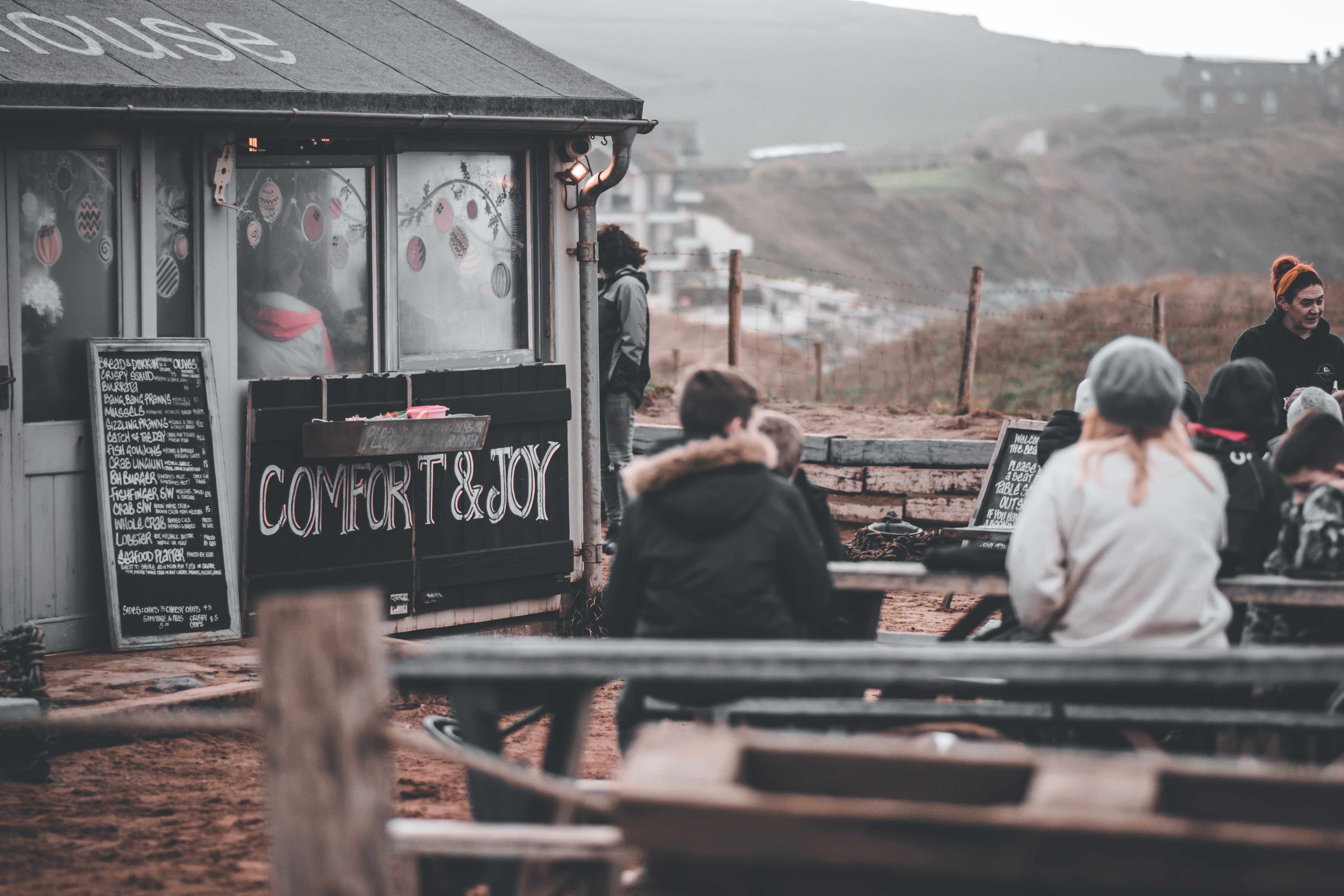 Thurlestone beach welcomes dogs all year road, and has a popular seafront café too (Elliott / Unsplash)