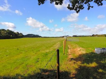 Looking towards the farm from the bottom of the field (added by manager 18 aug 2019)