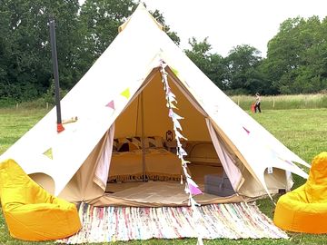 Standard bell tent containing  one double air bed,2 single air beds.lantern,bunting and picnic table (added by manager 28 jul 2022)