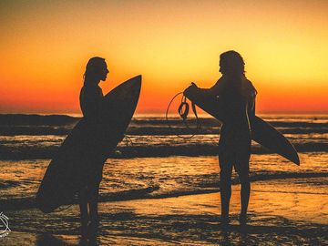Surfing at sunset (added by manager 19 jan 2017)