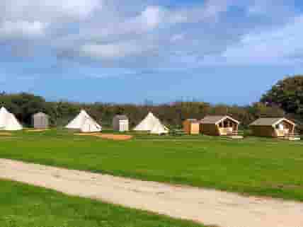 Looking at the bell tents and camping pods.