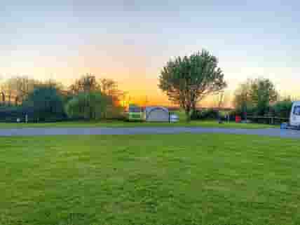 Grass pitch at sunset