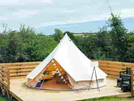 Bell tent on a wooden deck