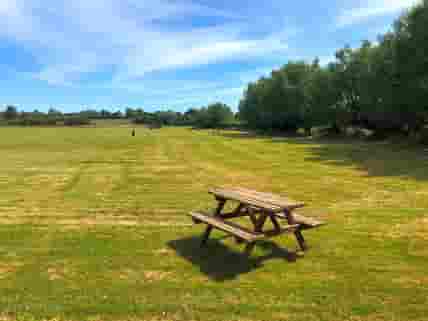 One of our picnic tables free for you to use.