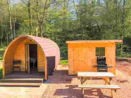 Cooking shed and picnic table by the pod