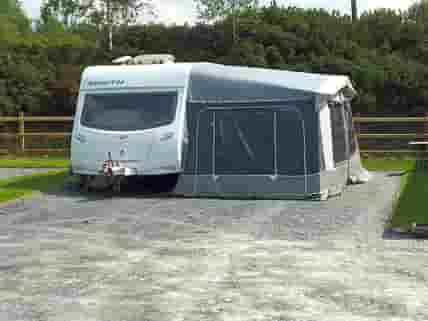 Caravan with awning on hardstanding plot