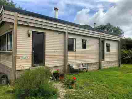 The Cabin, an upcycled vintage static caravan with woodburner.
