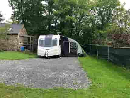 Space for caravan and awning with parking in front