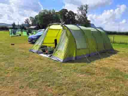 Our pitch with car next to car. 7.4m x 3.6m tent with hook up