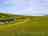 Compton Farm Caravan and Camping: Visitor image of the morning view with cliffs in the background 