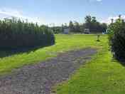 Hardstanding pitch with grass area to the side. (added by manager 01 Oct 2020)