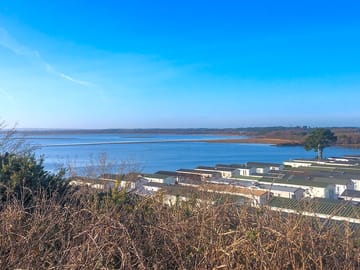 View over the caravans to Poole Harbour (added by manager 22 Aug 2022)