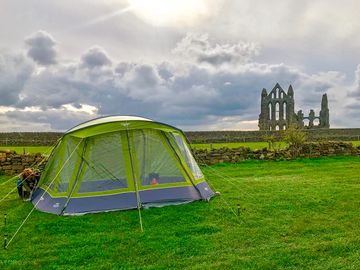 Tent pitch with view of the Abbey (added by manager 08 Jul 2022)
