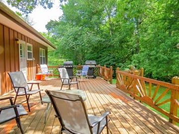 Large deck with grill, table and chairs