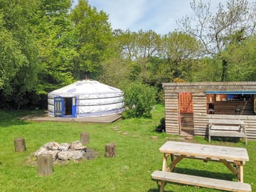 Sunshine Yurt with kitchen dining area firepit and picnic table