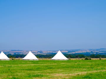 Choose your own pitch or hire a bell tent