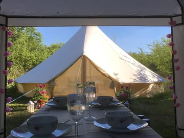 Outdoor dining by the bell tents