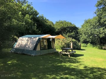 Fully-serviced grass tent pitch