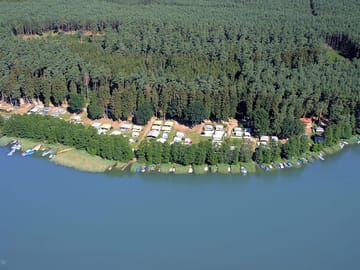 Aerial view of the site's lakeside setting