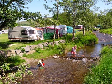 Children love exploring and fishing in the shallow stream at Hendwr Caravan Park (added by manager 12 Jul 2012)