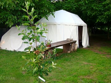 The 5m diameter Yurt shaped dome sleeps 4 or 5.        The 3m 'Bud' can join on, and sleeps two. (added by manager 02 Oct 2012)