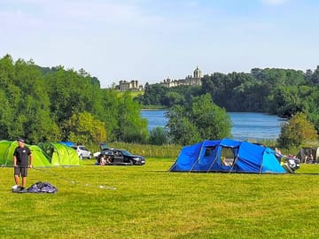 Camping field overlooking Castle Howard and lake.