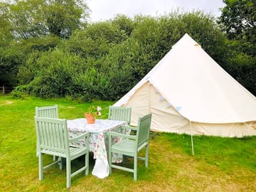 Bell tent with table outside