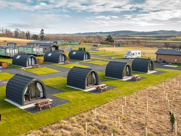 Camping pods with touring and camping pitches in the background (added by manager 15 Feb 2022)