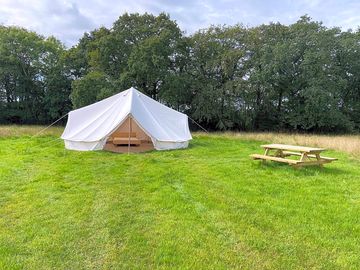 Outside of bring your own bedding bell tent.