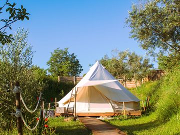 Take a stroll to your off-grid luxury bell tent...