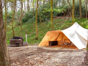 Bell tent and hot tub tucked away in the woods