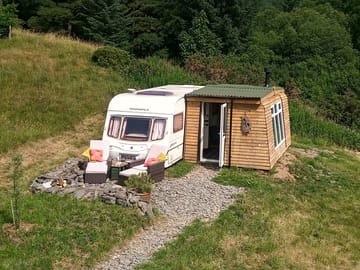 Nestled in a wildflower meadow next to Clocaenog Forest.