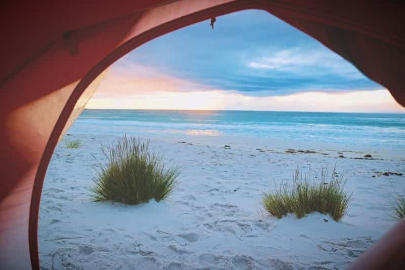 View from a pop-up tent on the beach (Roxanne Desgagnés / Unsplash)