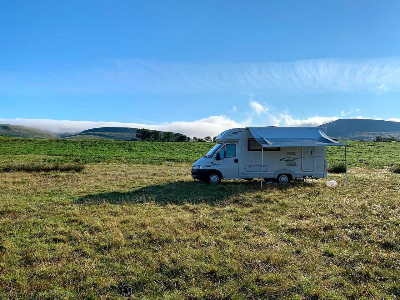 A self-contained motorhome lets you stay at wild campsites like this one in Cumbria