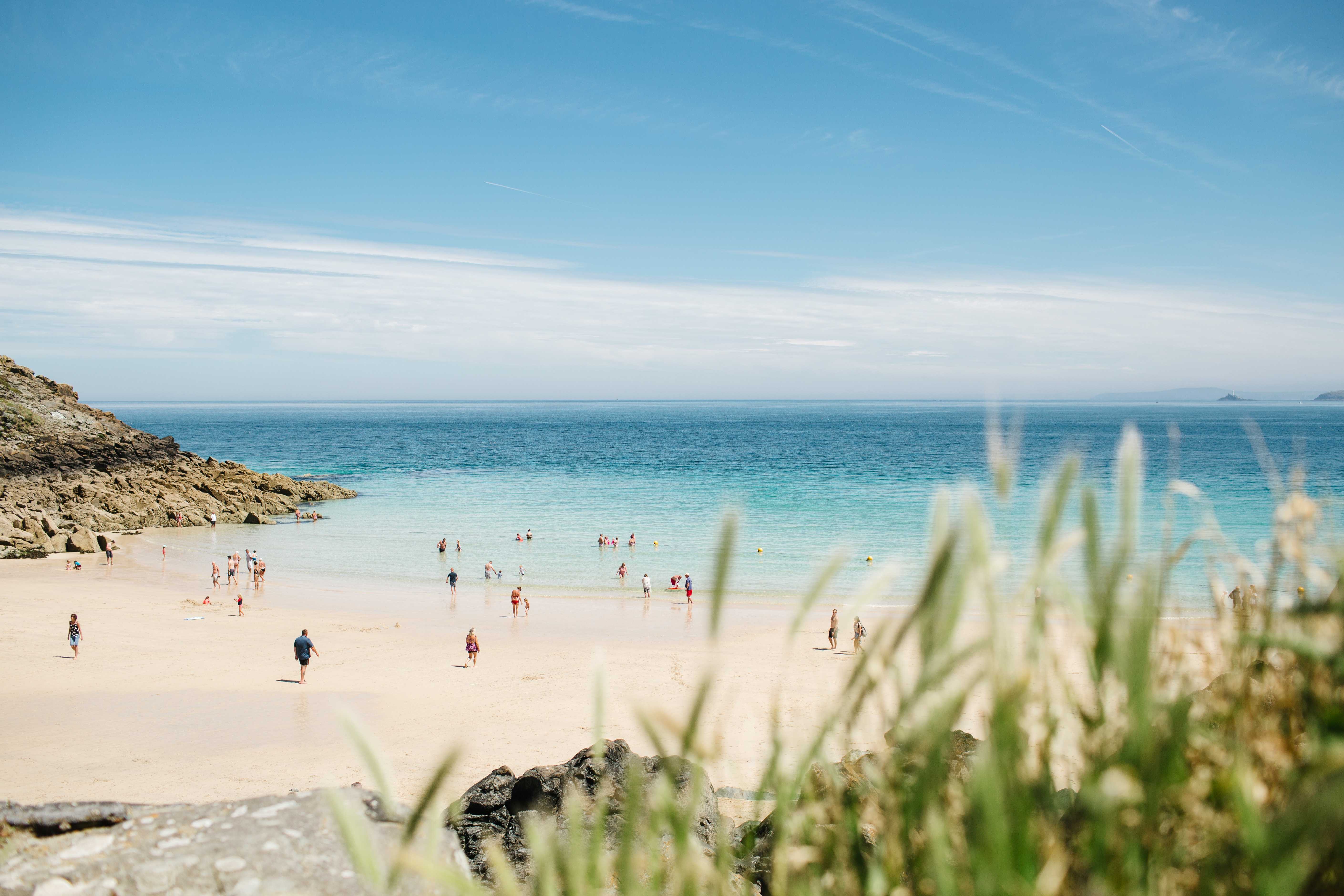 There are lots of stunning coastal and country spots to explore on your Cornwall camping break (photo of St Ives beach by Angela Pham/Unsplash)