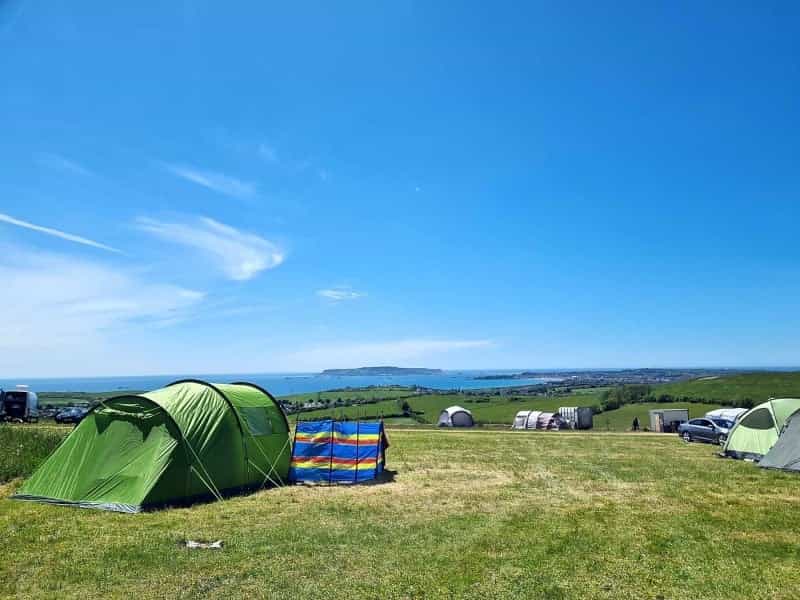 Walk the coast path or hit the beach from Donkey Down Campsite